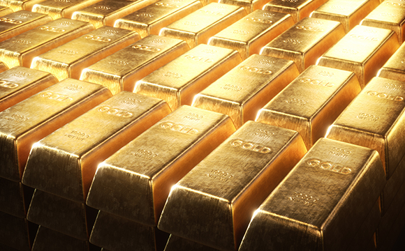 a couple dozen of 1kg of gold bullions stacked in top of one another in rows 